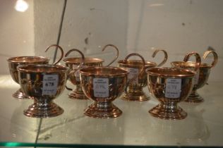 A set of seven plated pedestal cups.