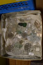 A small collection of cut glass decanter stoppers etc.