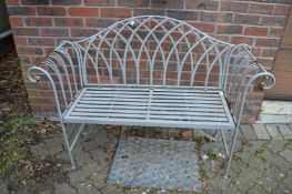 A Regency style wrought iron garden bench.