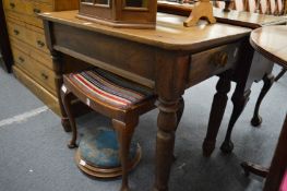 A small elm scrubbed top kitchen table with a drawer to on end on turned legs.
