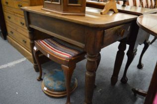 A small elm scrubbed top kitchen table with a drawer to on end on turned legs.