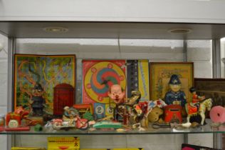 A good collection of early toys, games and puzzles to include a Schuco motorcyclist.