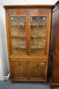 A large 19th century mahogany standing four door corner cabinet.