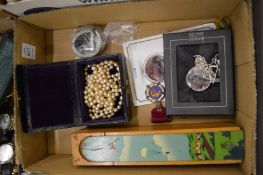 A pearl necklace and other items.