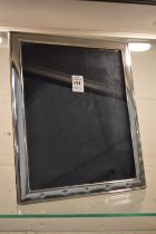 A Carrs large silver photograph frame, photo size 10" x 8".