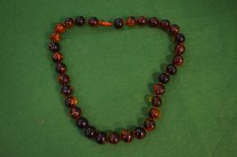 An amber bead necklace.