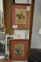 A pair of small paintings of Hussars on horseback.