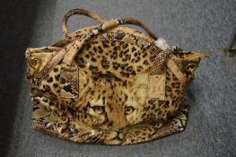 A Butler & Wilson leopard print handbag.