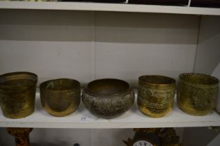 Five Islamic engraved brass bowls.