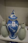 A Chinese blue and white baluster shaped vase and cover together with a pair of celadon glazed