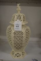 A pierced cream ware vase and cover.