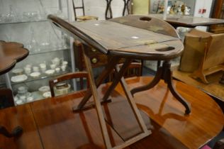 A butlers style tray top table with folding flaps.