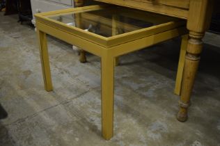 A glass top coffee table.