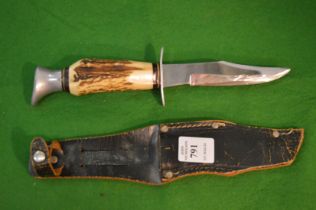 A small sheath knife.