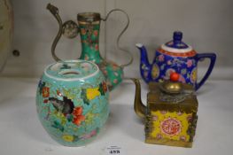 A Chinese barrel shaped famille jaune jar and cover, two teapots and a ewer.