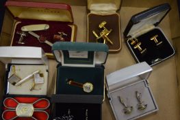 A quantity of boxed cufflinks.