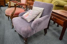 A small Victorian upholstered bedroom chair on turned supports.