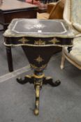 A good Victorian papier mache lacquer sewing table with tripod support.