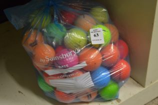 A bag of fifty mixed coloured golf balls.