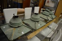 Four green painted copper lantern tops.