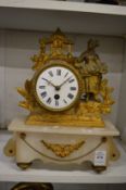An alabaster and gilt metal French mantel clock.