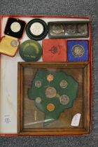 Framed and glazed set of Rhodesian coins and various other coins.