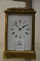 A brass carriage clock.