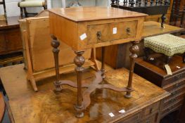 A small walnut single drawer occasional table.