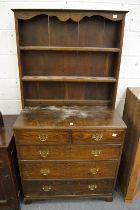 A small oak dresser with secretaire style drawer.