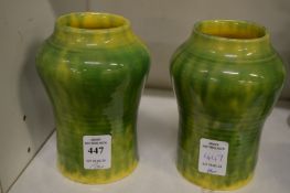 Two small green glazed vases.