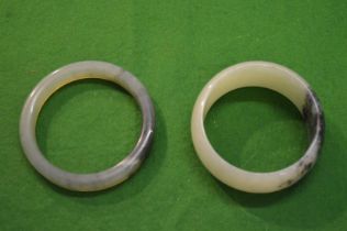 Two jade bangles.