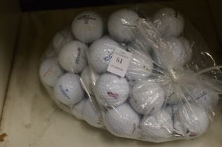 A bag of fifty Pinnacle golf balls.