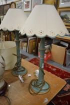 A pair of turned wood and painted table lamps.