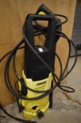 A Karcher pressure washer with accessories.