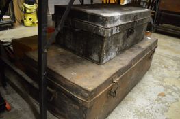 Two old steel trunks and another trunk.