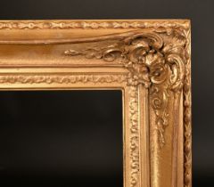 A 20th Century gilt composition swept frame, rebate size 40" x 30" (102 x 76cm).