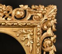 A 19th Century carved frame with oval aperture, rebate size 16.5" x 13" (42 x 33cm).