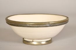 A glazed studio pottery bowl with applied metal rim and foot, 3" (7cm) high.