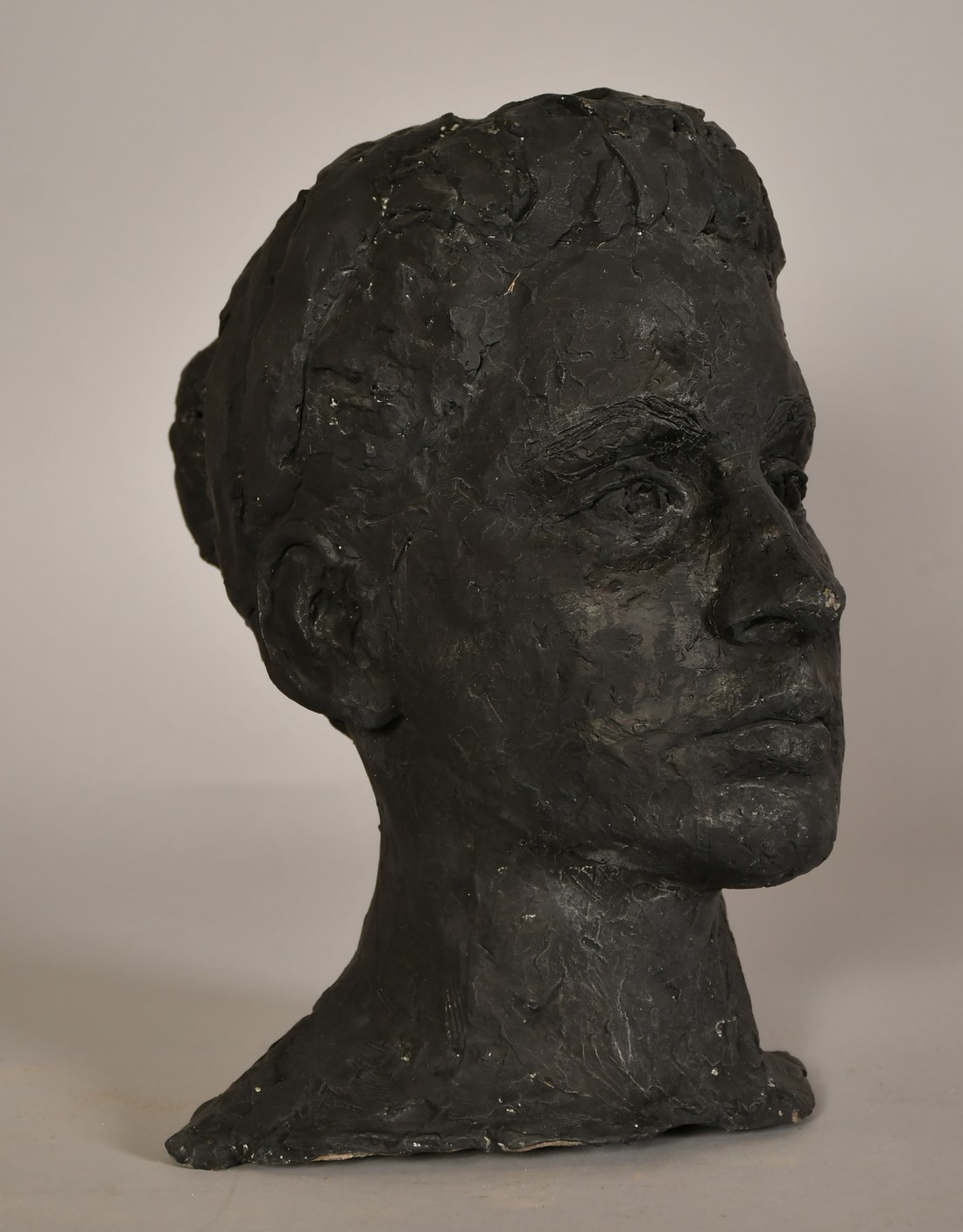 Sally Hersh (1936-2010), head study of a young woman with a bun, ciment fondu, 12" (30cm) high - Image 2 of 4