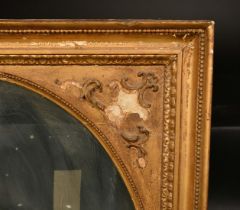 A 19th Century gilt frame with decorative spandrels and inset oval glass, rebate size 30" x 25" (
