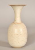 A studio pottery vase with speckled glaze, impressed signature stamp, 7" (18cm) high.