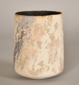 A studio pottery vase with ribbed charcoal interior and a textured finish to the exterior, 5.25" (