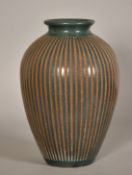 Roger Calero, Nicaragua, a green vase with incised textured decoration, signed, 13.5" (34cm) high.