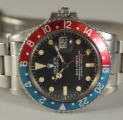 A ROLEX GMT-MASTER OYSTER PERPETUAL SUPELATIVE CHRONOMETER, 580, "PEPSI" DIAL GENTLEMAN'S