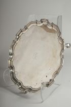 A PIE CRUST SALVER on three pad feet. 12ins diameter. Initial B. Birmingham 1928. Weight 24ozs.