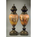 A LARGE PAIR OF PORCELAIN NAPOLEONIC VASES with an all round design of Napoleon. 34ins high.