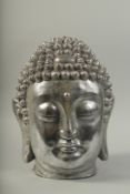 A LARGE SILVERED BUDDHA HEAD. 17ins high.
