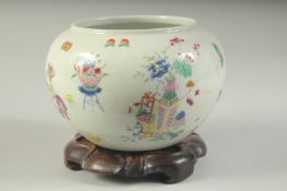 A LATE 19TH CENTURY CHINESE POLYCHROME JAR and hardwood stand. Jar 11cms high.