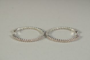 A PAIR OF WHITE GOLD AND DIAMOND HOOP EARRINGS.