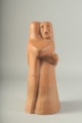 A TERRACOTTA SCULPTURE OF TWO FIGURES. 14ins high.